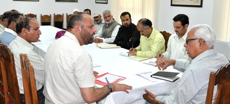 Kashmir traders hold sit in outside Raj Bhavan